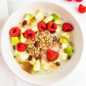 A breakfast cereal made with chopped apple, sultanas and fresh raspberries.