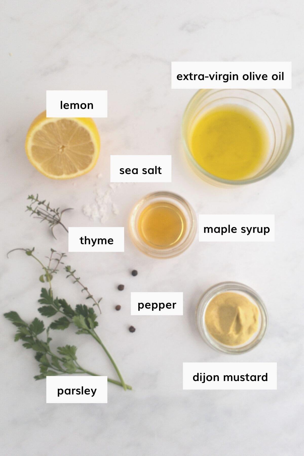 Recipe ingredients for lemon herb vinaigrette laid out and labelled.