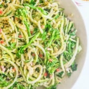 A bowl filled with courgette spaghetti noodles and vegetables.