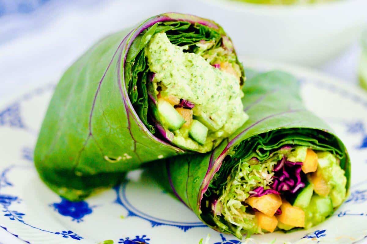 A close up of two raw veggie wraps and their filling.